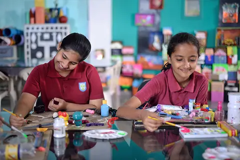 Anand Niketan students painting in the art studio