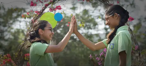 Anand Niketan students sharing a high five